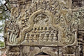 Ta Prohm temple - in sculpted frontons most of Buddha images have been erased 